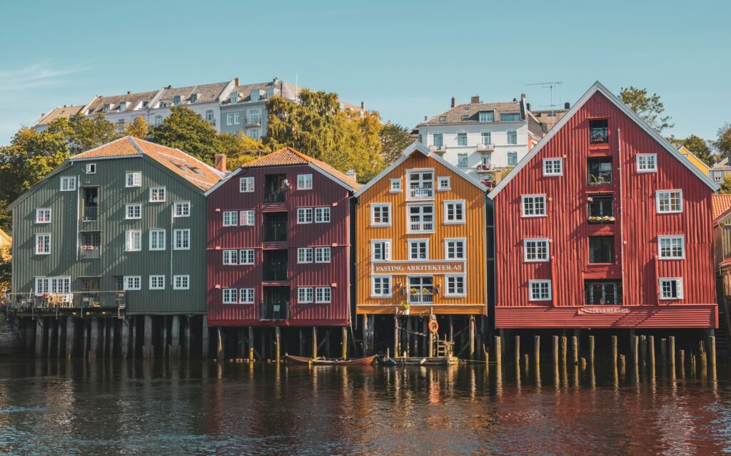 a row of houses sitting on top of a lake
